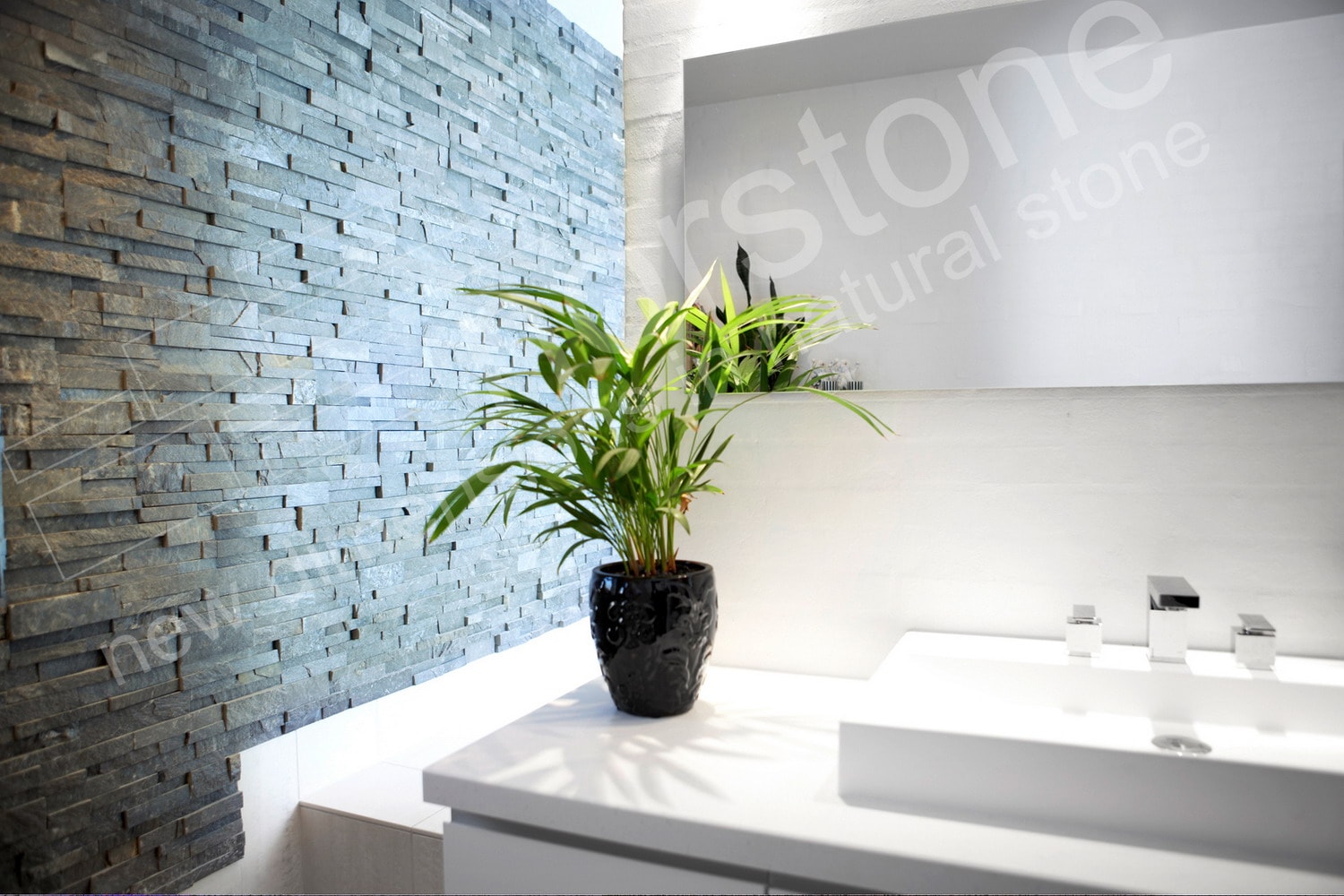 Norstone Charcoal Stacked Stone Rock Panels on a large feature wall between the bathroom and large walk in shower